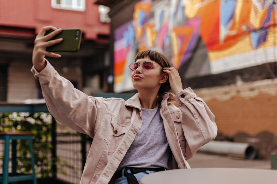 An influencer taking selfie.