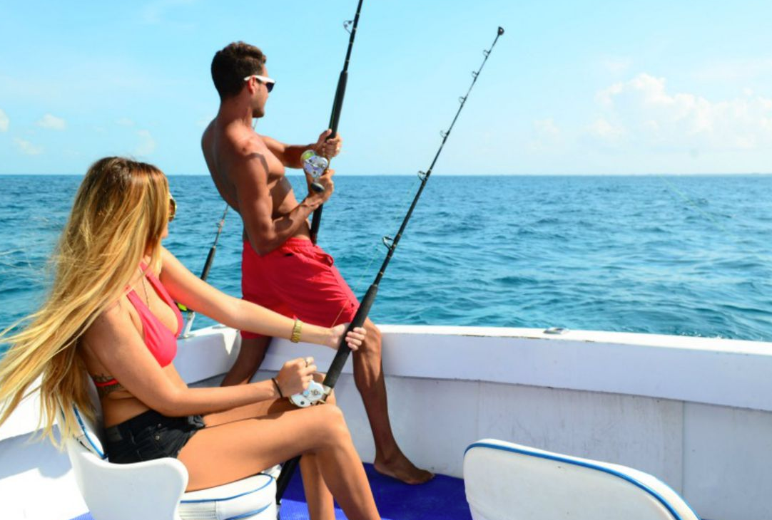 A man and woman are enjoying half day fishing tour together on a boat