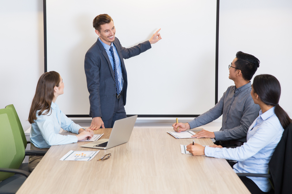 An entrepreneur discusses with his colleagues