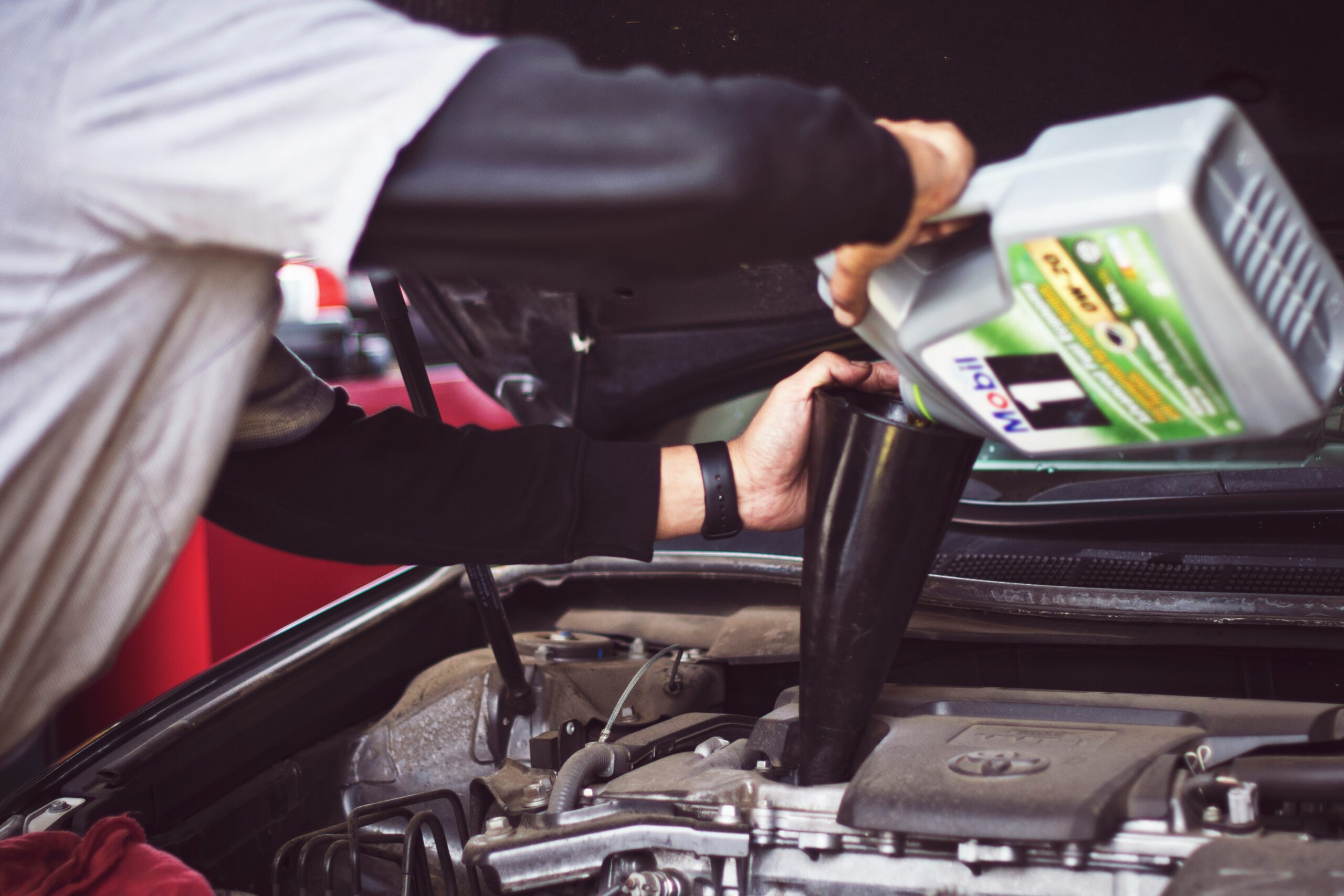Man fixing car issues and correct the engine